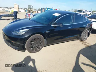2018 Tesla Model 3 Long Range Battery with VIN 5YJ3E1EA0JF056979, listed as a IAAI auction lot 41865849 with 97,319 mi miles. Bid and sale history available at carsss.com. Image 2.