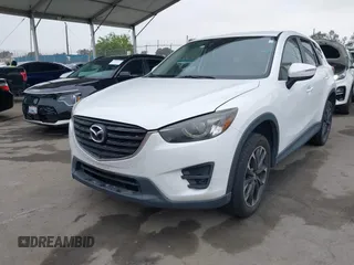 2016 Mazda CX-5 Grand Touring with VIN JM3KE4DY7G0737232, listed as a IAAI auction lot 42158279 with Not Provided miles and . Bid and sale history available at DreamBid. Image 17.
