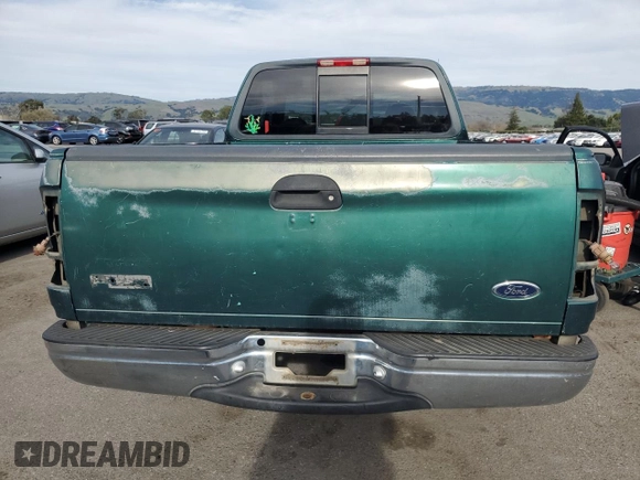1999 Ford F-250 z VIN 1FTRX27LXXKA16798, wystawiony jako Copart lot #45242115 z przebiegiem Nie podano mil oraz Szkoda całkowita • Salvage title. Historia ofert i sprzedaży dostępna na DreamBid. Obrazek 6.