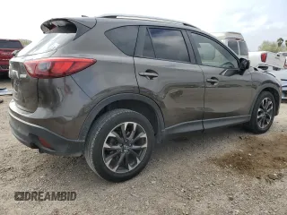 2016 Mazda CX-5 Grand Touring z VIN JM3KE2DY7G0735355, wystawiony jako Copart lot #49438285 z przebiegiem 132 731 mil mil oraz Szkoda całkowita • Salvage title. Historia ofert i sprzedaży dostępna na DreamBid. Obrazek 3.