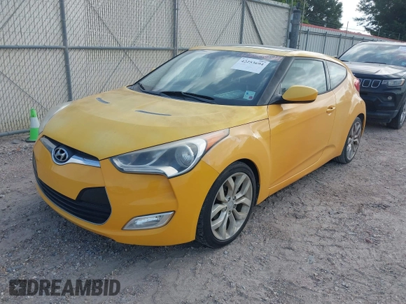 2012 Hyundai Veloster w/Gray Int z VIN KMHTC6AD7CU026855, wystawiony jako IAAI lot #42253694 z przebiegiem 119 802 mil mil oraz . Historia ofert i sprzedaży dostępna na DreamBid. Obrazek 2.