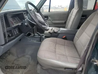 1996 Jeep Cherokee Sport with VIN 1J4FJ68S3TL251074, listed as a Copart auction lot 59593955 with 181,482 mi miles and Salvage title. Bid and sale history available at DreamBid. Image 7.