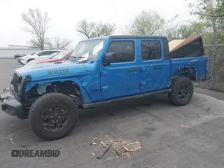 2023 Jeep Gladiator Sport S z VIN 1C6HJTAG6PL579136, wystawiony jako IAAI lot #41946641 z przebiegiem 14 856 mil mil oraz . Historia ofert i sprzedaży dostępna na DreamBid. Obrazek 6.