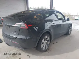 2023 Tesla Model Y Long Range with VIN 7SAYGDEE0PF909610, listed as a IAAI auction lot 41906081 with 20,656 mi miles and . Bid and sale history available at DreamBid. Image 4.