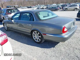 2005 Jaguar XJ with VIN SAJWA79C85SG48974, listed as a IAAI auction lot 41844684 with 154,145 mi miles. Bid and sale history available at carsss.com. Image 3.