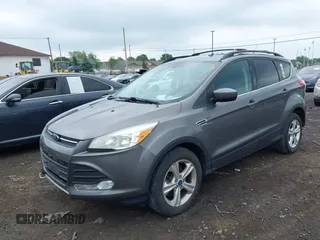 2013 Ford Escape SE with VIN 1FMCU9GX4DUB35629, listed as a IAAI auction lot 42446685 with 103,420 mi miles and . Bid and sale history available at DreamBid. Image 2.