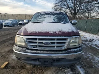 1999 Ford F-150 with VIN 1FTRF17W7XNA44872, listed as a Copart auction lot 41815695 with 182,678 mi miles and Salvage title. Bid and sale history available at DreamBid. Image 5.
