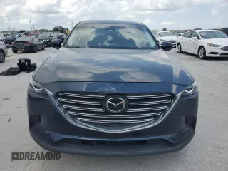 2020 Mazda CX-9 Touring with VIN JM3TCACY1L0423340, listed as a Copart auction lot 57389305 with 64,737 mi miles and Salvage title. Bid and sale history available at DreamBid. Image 5.