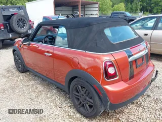 2011 MINI Convertible with VIN WMWZN3C57BTZ89303, listed as a IAAI auction lot 42352242 with 146,448 mi miles and . Bid and sale history available at DreamBid. Image 3.