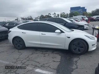 2021 Tesla Model 3 Long Range with VIN 5YJ3E1EB6MF878957, listed as a IAAI auction lot 41915482 with 59,578 mi miles. Bid and sale history available at carsss.com. Image 13.