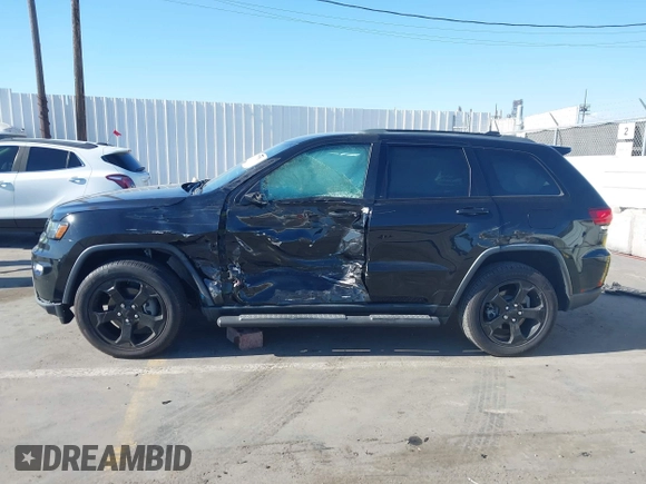2018 Jeep Grand Cherokee Laredo E with VIN 1C4RJFAG4JC367924, listed as a IAAI auction lot 42065114 with 65,250 mi miles. Bid and sale history available at carsss.com. Image 14.