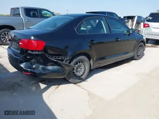 2014 Volkswagen Jetta Sedan S with VIN 3VW2K7AJ9EM386678, listed as a IAAI auction lot 41833784 with 98,390 mi miles. Bid and sale history available at carsss.com. Image 4.