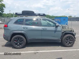 2015 Jeep Cherokee Trailhawk with VIN 1C4PJMBB0FW528421, listed as a IAAI auction lot 42591132 with 166,425 mi miles and . Bid and sale history available at DreamBid. Image 13.