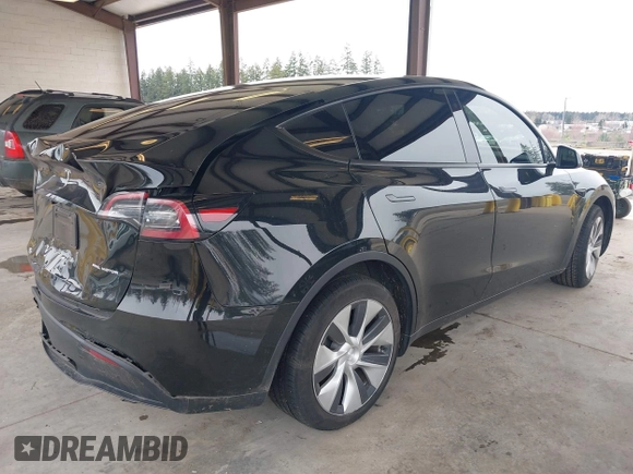 2023 Tesla Model Y Long Range with VIN 7SAYGDEE4PF789102, listed as a IAAI auction lot 41788860 with 88,457 mi miles and . Bid and sale history available at DreamBid. Image 4.