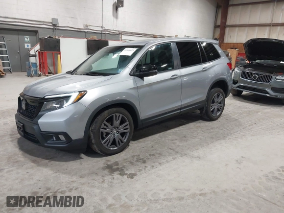 2021 Honda Passport EX-L with VIN 5FNYF8H56MB000107, listed as a IAAI auction lot 41868429 with 66,572 mi miles and . Bid and sale history available at DreamBid. Image 2.