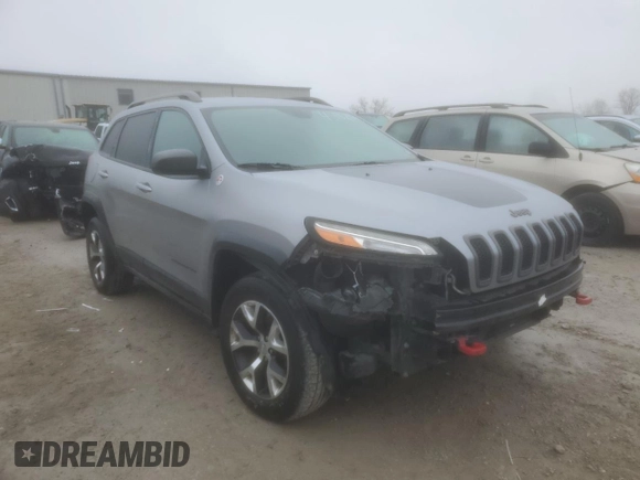 2014 Jeep Cherokee Trailhawk with VIN 1C4PJMBS1EW240177, listed as a Copart auction lot 43321715 with 212,339 mi miles and Salvage title. Bid and sale history available at DreamBid. Image 4.