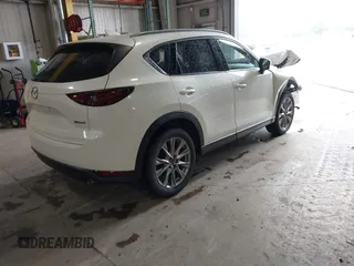 2020 Mazda CX-5 Grand Touring with VIN JM3KFADMXL0742038, listed as a IAAI auction lot 42292400 with 68,339 mi miles and . Bid and sale history available at DreamBid. Image 4.