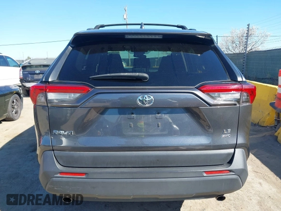 2019 Toyota RAV4 LE with VIN JTMG1RFV3KD025974, listed as a IAAI auction lot 41879264 with 131,933 mi miles and . Bid and sale history available at DreamBid. Image 16.