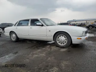 1999 Jaguar XJ with VIN SAJKD6041XC876928, listed as a Copart auction lot 60038405 with 63,917 mi miles and Clean title. Bid and sale history available at DreamBid. Image 4.