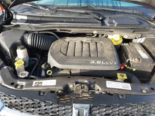 2014 Dodge Grand Caravan SXT with VIN 2C4RDGCG2ER267358, listed as a IAAI auction lot 41001692 with 186,763 mi miles and . Bid and sale history available at DreamBid. Image 10.