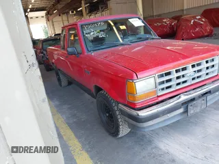 1991 Ford Ranger XL z VIN 1FTCR14U9MTA30916, wystawiony jako IAAI lot #42357855 z przebiegiem 443 314 mil mil oraz . Historia ofert i sprzedaży dostępna na DreamBid. Obrazek 1.