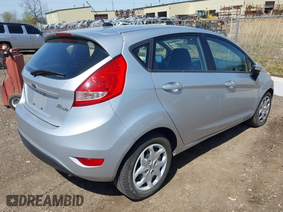 2013 Ford Fiesta SE with VIN 3FADP4EJ9DM157685, listed as a IAAI auction lot 42145511 with 101,331 mi miles. Bid and sale history available at carsss.com. Image 4.