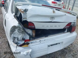 1995 Toyota Camry LE z VIN 4T1SK12E3SU510495, wystawiony jako IAAI lot #42168534 z przebiegiem 270 323 mil mil oraz . Historia ofert i sprzedaży dostępna na DreamBid. Obrazek 6.