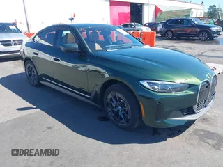 2023 BMW i4 eDrive35 z VIN WBY43AW04PFR33718, wystawiony jako IAAI lot #42062132 z przebiegiem 7 639 mil mil oraz . Historia ofert i sprzedaży dostępna na DreamBid. Obrazek 1.