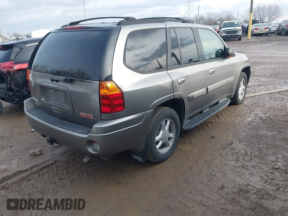 2005 GMC Envoy SLT with VIN 1GKDT13S752276414, listed as a IAAI auction lot 41052684 with 200,919 mi miles. Bid and sale history available at carsss.com. Image 4.
