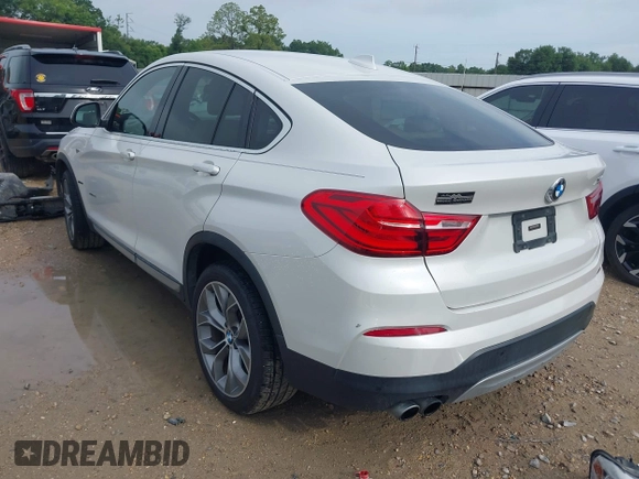 2015 BMW X4 xDrive28i with VIN 5UXXW3C51F0M86668, listed as a IAAI auction lot 42489071 with 59,694 mi miles and . Bid and sale history available at DreamBid. Image 3.