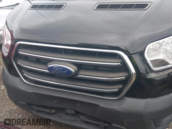 2020 Ford Transit Cargo with VIN 1FTYE1Y80LKB76611, listed as a IAAI auction lot 42445263 with 104,540 mi miles and . Bid and sale history available at DreamBid. Image 6.
