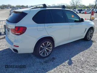 2015 BMW X5 xDrive50i with VIN 5UXKR6C5XF0J76697, listed as a IAAI auction lot 41953074 with 141,377 mi miles and . Bid and sale history available at DreamBid. Image 4.