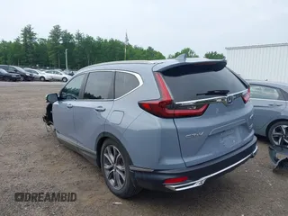 2021 Honda CR-V Touring with VIN 7FART6H91ME022993, listed as a IAAI auction lot 42439344 with 30,477 mi miles and . Bid and sale history available at DreamBid. Image 3.