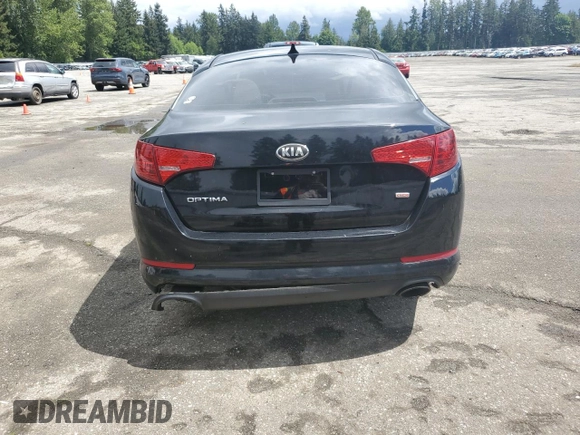 2013 Kia Optima LX z VIN 5XXGM4A79DG144608, wystawiony jako Copart lot #57461585 z przebiegiem 120 677 mil mil oraz Szkoda całkowita • Salvage title. Historia ofert i sprzedaży dostępna na DreamBid. Obrazek 6.