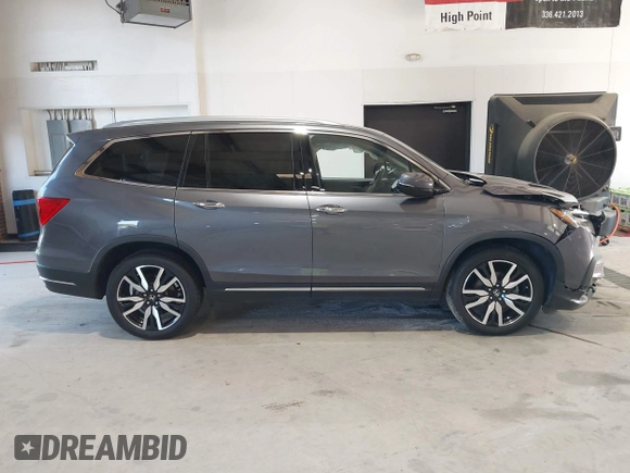 2021 Honda Pilot Touring 8-Passenger with VIN 5FNYF6H95MB048527, listed as a IAAI auction lot 42542138 with 40,584 mi miles and . Bid and sale history available at DreamBid. Image 13.