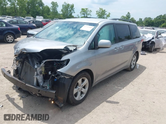 2011 Toyota Sienna LE AAS with VIN 5TDKK3DCXBS156328, listed as a IAAI auction lot 42721542 with 153,286 mi miles and . Bid and sale history available at DreamBid. Image 2.