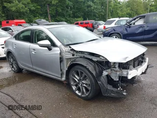 2016 Mazda 6 i Grand Touring with VIN JM1GJ1W53G1454378, listed as a IAAI auction lot 42494928 with 31,304 mi miles and . Bid and sale history available at DreamBid. Image 1.