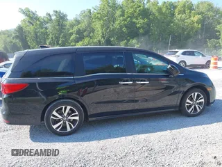 2021 Honda Odyssey Touring with VIN 5FNRL6H84MB027396, listed as a IAAI auction lot 42616650 with 67,207 mi miles and . Bid and sale history available at DreamBid. Image 13.