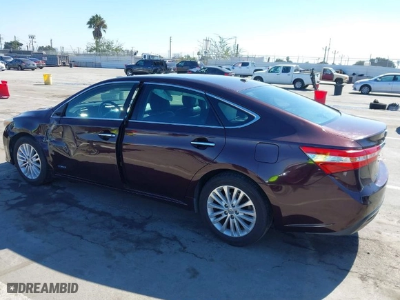 2014 Toyota Avalon Hybrid Limited with VIN 4T1BD1EB1EU018886, listed as a IAAI auction lot 41651673 with 137,890 mi miles. Bid and sale history available at carsss.com. Image 3.