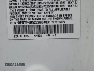 2012 Honda Pilot EX-L z VIN 5FNYF4H52CB084031, wystawiony jako Copart lot #59627595 z przebiegiem 171 818 mil mil oraz Czysty tytuł • Clean title. Historia ofert i sprzedaży dostępna na DreamBid. Obrazek 13.