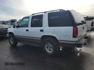 1999 GMC Yukon with VIN 1GKEK13RXXJ735870, listed as a Copart auction lot 44988505 with 150,557 mi miles and Salvage Title. Bid and sale history available at carsss.com. Image 2.