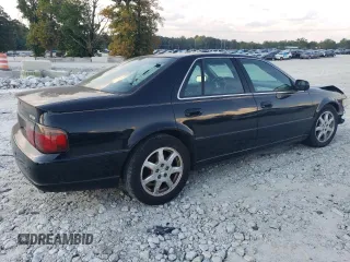 2001 Cadillac Seville Touring STS z VIN 1G6KY549X1U282930, wystawiony jako Copart lot #72750504 z przebiegiem Nie podano mil oraz Szkoda całkowita • Salvage title. Historia ofert i sprzedaży dostępna na DreamBid. Obrazek 3.