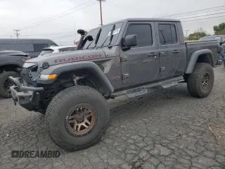 2021 Jeep Gladiator Rubicon with VIN 1C6JJTBG9ML512347, listed as a Copart auction lot 43197415 with 134,608 mi miles and Salvage title. Bid and sale history available at DreamBid. Image 1.