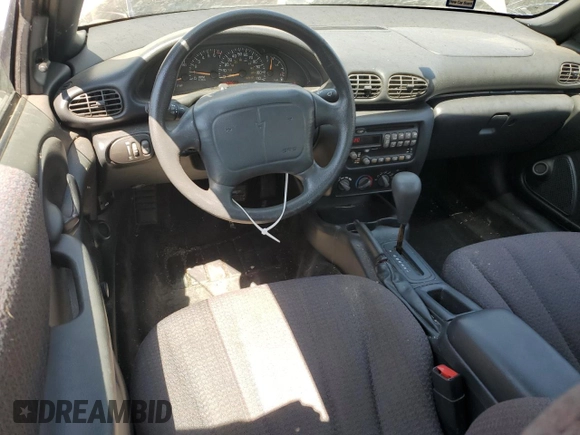 2002 Pontiac Sunfire SE z VIN 1G2JB124327288986, wystawiony jako Copart lot #64072634 z przebiegiem 122 306 mil mil oraz Szkody całkowita. Historia ofert i sprzedaży dostępna na DreamBid. Obrazek 8.