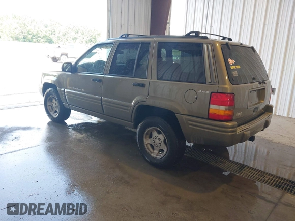 1998 Jeep Grand Cherokee Laredo with VIN 1J4GZ48S4WC262249, listed as a IAAI auction lot 42739473 with 94,094 mi miles and . Bid and sale history available at DreamBid. Image 3.