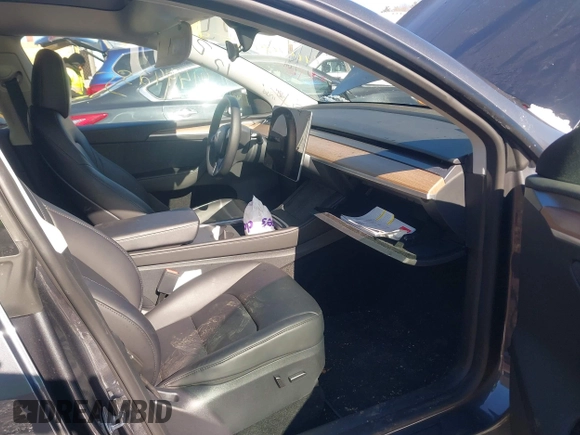 2023 Tesla Model Y Long Range with VIN 7SAYGAEE9PF905943, listed as a IAAI auction lot 41444255 with 11,179 mi miles and . Bid and sale history available at DreamBid. Image 5.