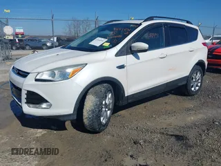 2013 Ford Escape SEL with VIN 1FMCU9HX1DUB37918, listed as a IAAI auction lot 41644931 with 153,726 mi miles and . Bid and sale history available at DreamBid. Image 2.