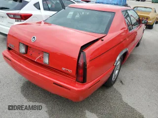 2002 Cadillac Eldorado z VIN 1G6EC129X2B106142, wystawiony jako Copart lot #74424164 z przebiegiem Nie podano mil oraz Szkody całkowita. Historia ofert i sprzedaży dostępna na DreamBid. Obrazek 3.