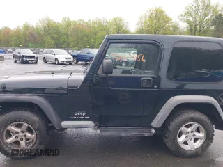 2004 Jeep Wrangler X with VIN 1J4FA39S94P707411, listed as a IAAI auction lot 42187856 with 189,519 mi miles. Bid and sale history available at carsss.com. Image 14.