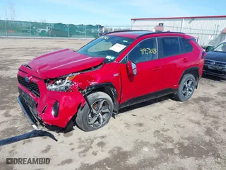 2021 Toyota RAV4 Prime SE with VIN JTMAB3FV2MD059200, listed as a IAAI auction lot 41957023 with 27,451 mi miles. Bid and sale history available at carsss.com. Image 2.